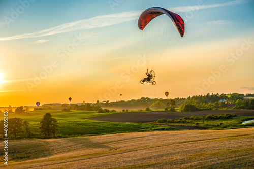 Powered paragliding over the countryside