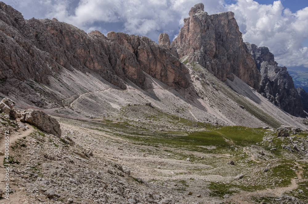 Chedul valley with Pizes da Cier mountain range on the left and Mont de Seura mountain on the right, as seen from Crespeina pass, Puez-Odle Nature park, Dolomites, South Tirol, Italy. Chedul valley with Pizes da Cier mountain range on the left and Mont de Seura mountain on the right, as seen from Crespeina pass, Puez-Odle Nature park, Dolomites, South Tirol, Italy.