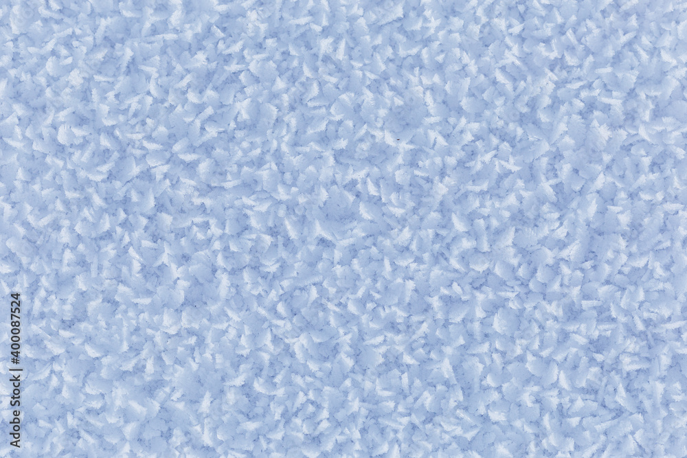 Winter, snow and frost, surface structure of a winter landscape with large crystals, white background. Winter, snow and frost, surface structure of a winter landscape with large crystals, white background.