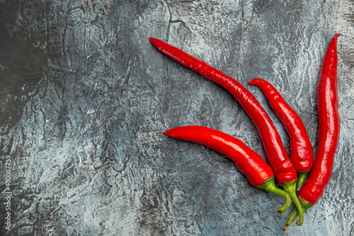 top view fresh spicy peppers on dark-light background pepper ripe photo