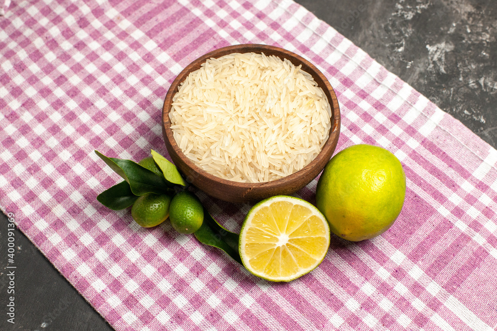 top view raw rice with lemons on dark background raw food fruit color top view raw rice with lemons on dark background raw food fruit color