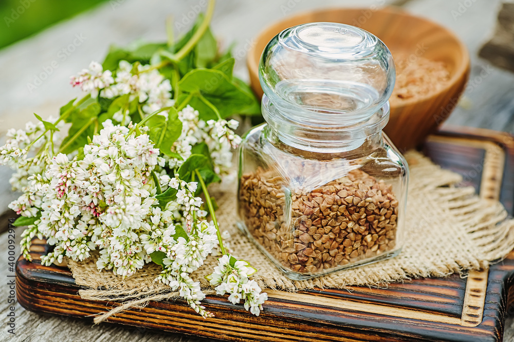Transparent jar for loose products with dry buckwheat. Transparent jar for loose products with dry buckwheat.