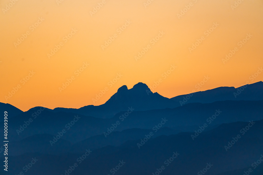 Mountain range at sunset or sunrise from the peak and of a magical mountain. Pedraforca Mountain, Bergueda, Barcelona, Catalonia, Spain. Serra del cadí - Natural Park Cadí-Moixeró, Pyrenees-Pirineus.
