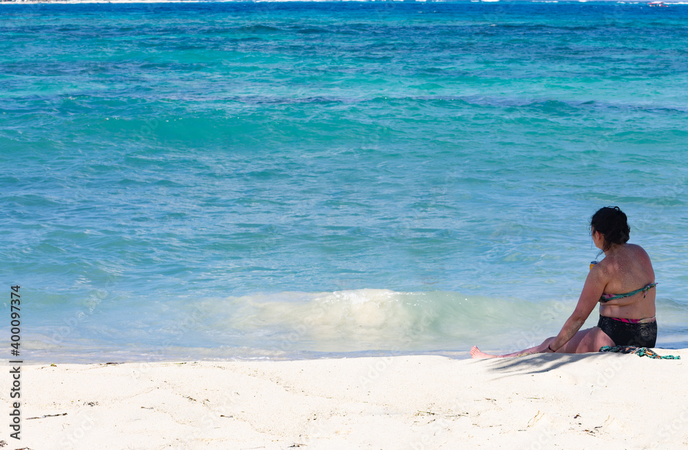 tourist looking to the horizon in a caribbean sea afternoon
tourist looking to the horizon in a caribbean sea afternoon