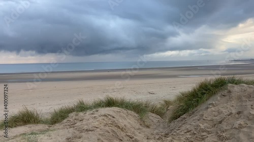 Camber sands beach, Rye, East Sussex UK, Camber is a flat sandy beach with giant sand dunes South coast England and popular with tourists and daytrippers in  only sand dune system in East Sussex, Uk photo