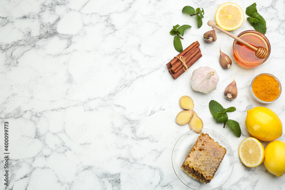 Flat lay composition with fresh products on white marble table, space for text. Natural antibiotics Flat lay composition with fresh products on white marble table, space for text. Natural antibiotics