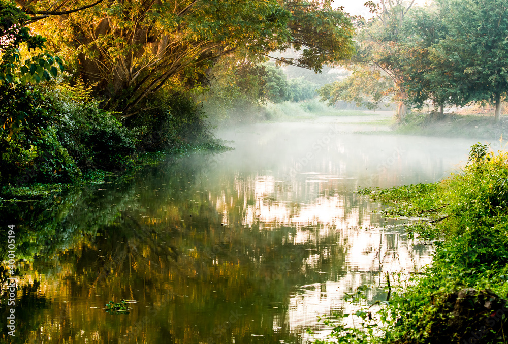 View of  canal and fog  in the morning, countryside Chiangmai province  Thailand