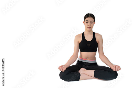 Young woman doing yoga practice isolated on white background. Flexible fit female body.