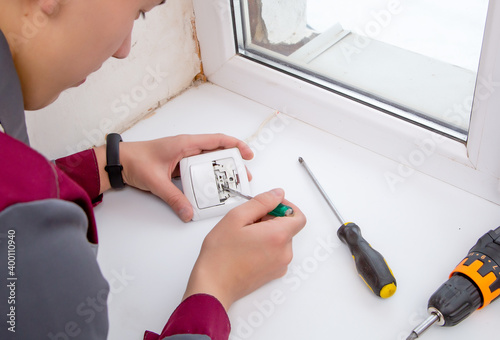 young specialist repairing electrical appliances