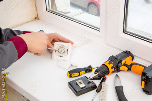 Wallpaper Mural young specialist repairing electrical appliances Torontodigital.ca