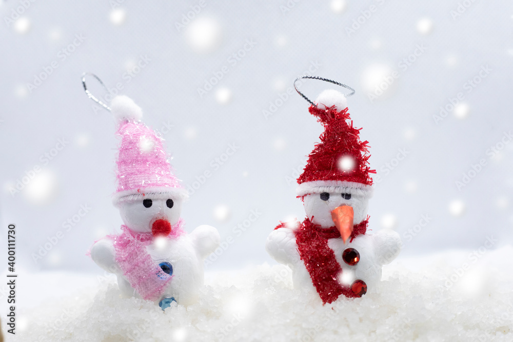 Merry Christmas and happy New Year greeting card with copy-space.Two snowmen standing in winter Christmas landscape.Winter background Merry Christmas and happy New Year greeting card with copy-space.Two snowmen standing in winter Christmas landscape.Winter background