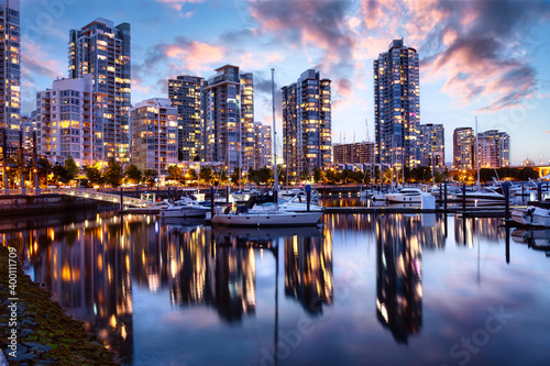 False Creek  Vancouver  British Columbia  Canada. Beautiful View of the Marina with boats and a modern Downtown City Buildings. Colorful Sunrise Twilight Sky.