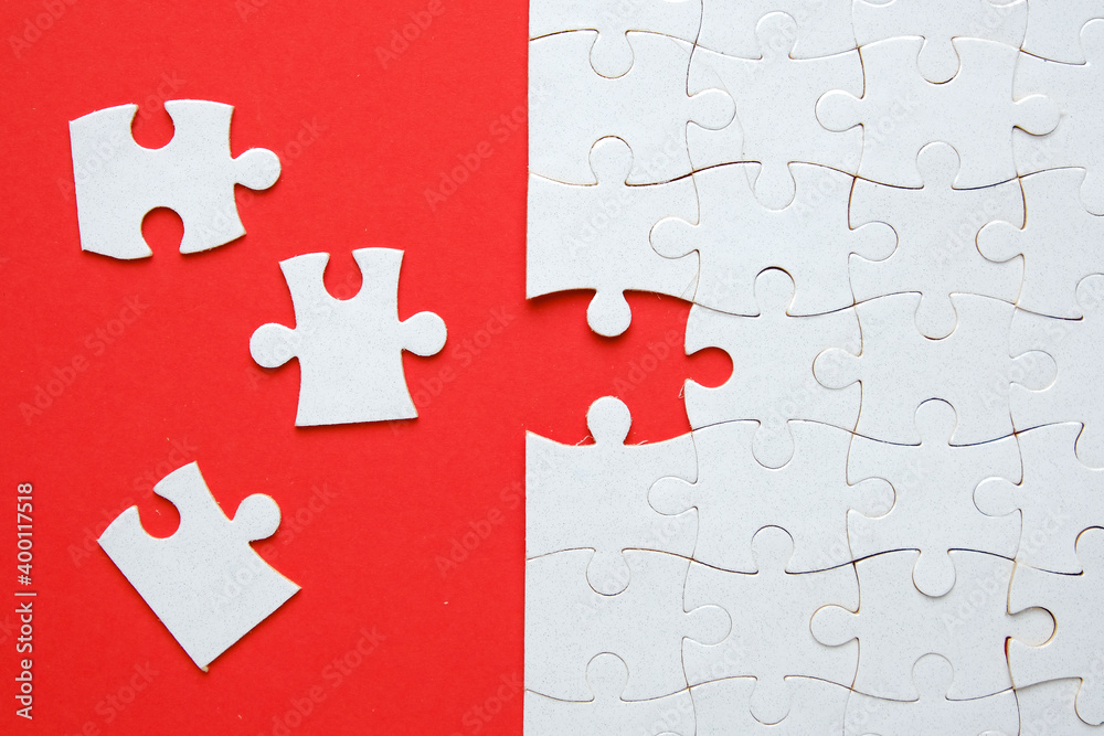 Fototapeta premium A picture of 3 jigsaw with one empty puzzle need to fit in for problem solving concept on red paper.