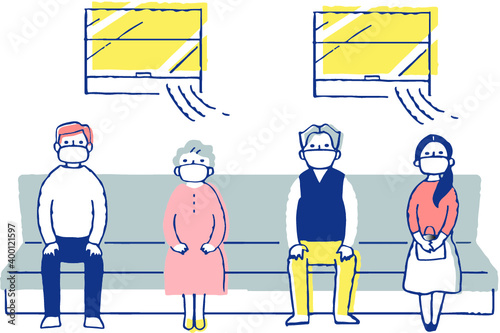 感染症予防対策　電車内で一定の間隔を空けて座る人々　