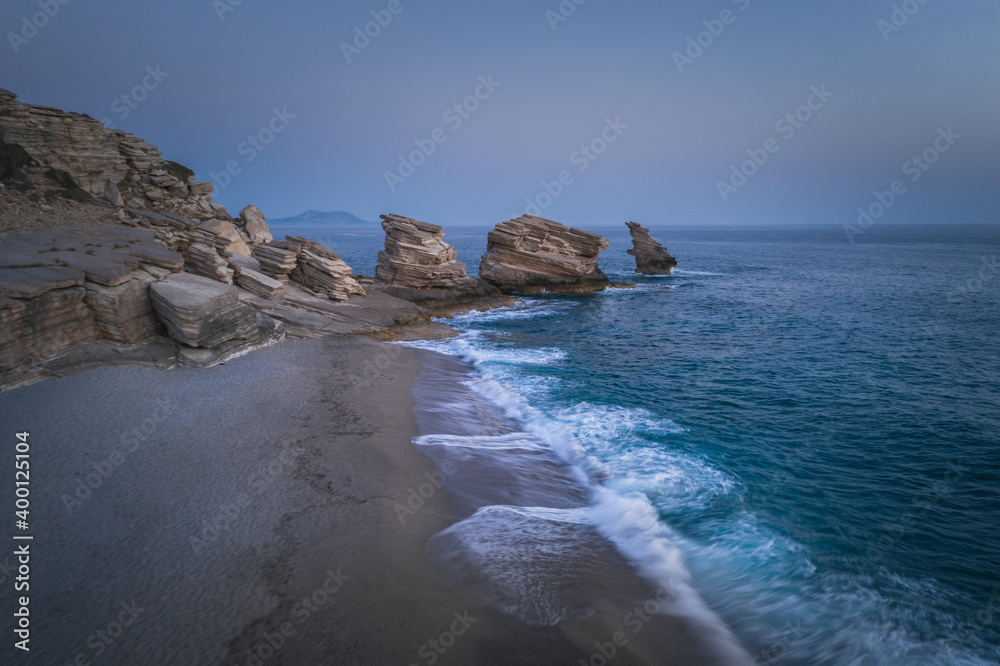 Triopetra beach, cliffs on Crete in a turquoise sea Triopetra beach, cliffs on Crete in a turquoise sea