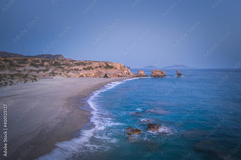 Triopetra beach, cliffs on Crete in a turquoise sea
