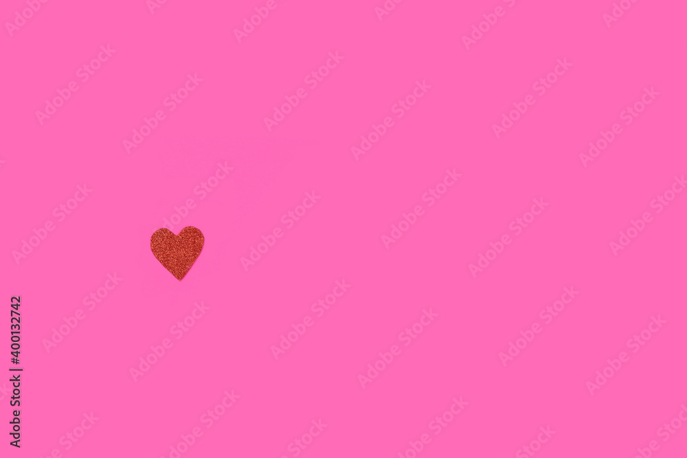 small lonely heart on a pink background. The concept of love. Single or Lonely. copy space