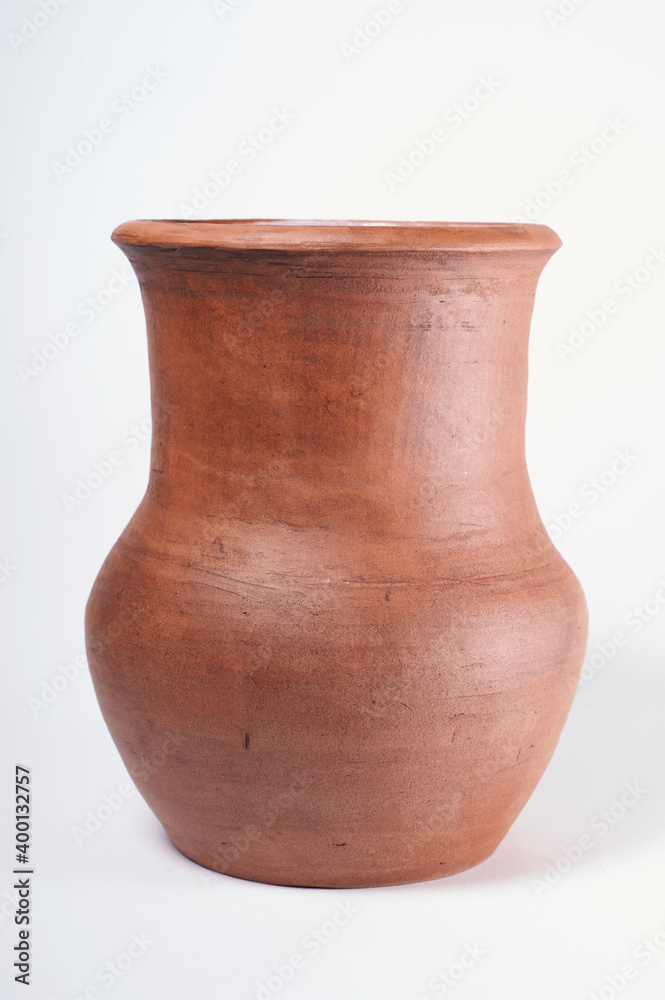 Pottery Craft, ceramic product with your own hands, made on a Potter's wheel, isolated on a white background Pottery Craft, ceramic product with your own hands, made on a Potter's wheel, isolated on a white background