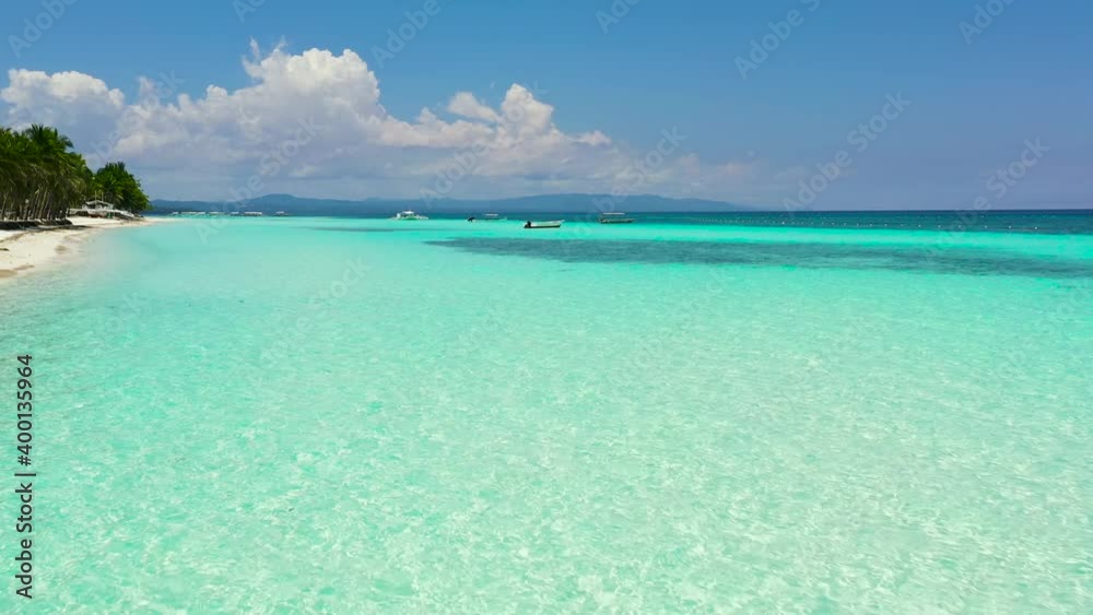 Beautiful tropical island with sand beach. Panglao, Philippines. Seascape with beautiful beach and palm trees. Beautiful tropical island with sand beach. Panglao, Philippines. Seascape with beautiful beach and palm trees.