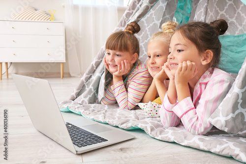 Cute little girls lying in ...