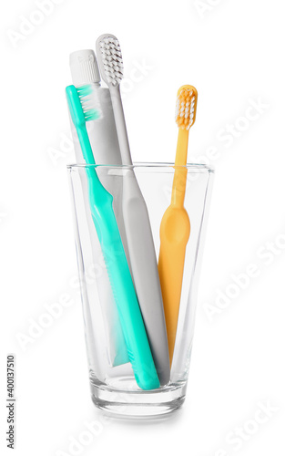 Holder with toothbrushes and toothpaste isolated on white background