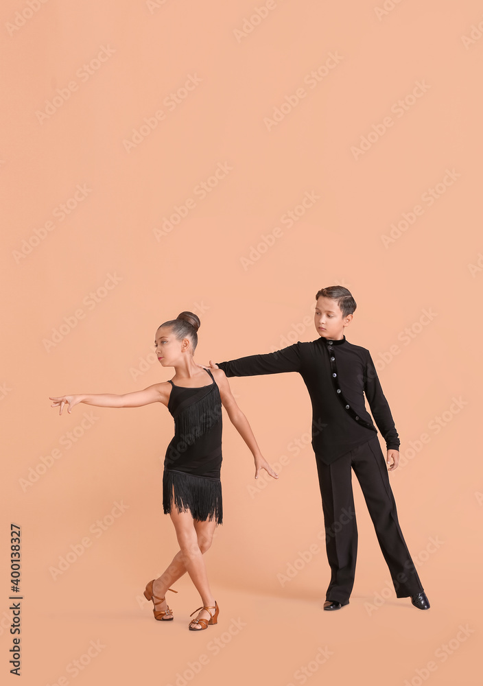 Cute little children dancing against color background