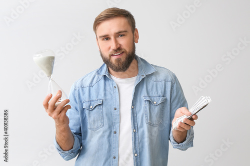 Young man with hourglass an...