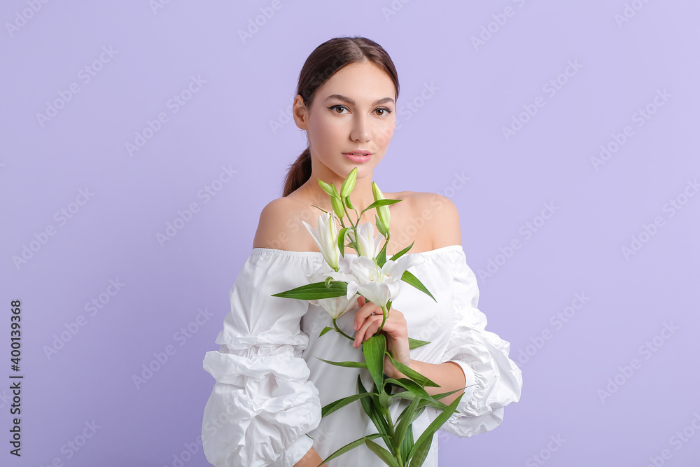 Beautiful young woman with fresh lilies on color background Beautiful young woman with fresh lilies on color background