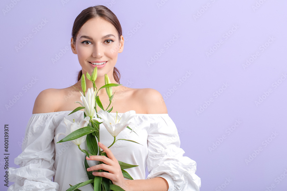 Beautiful young woman with fresh lilies on color background Beautiful young woman with fresh lilies on color background