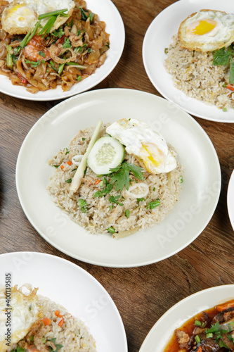 a plate of fried rice with fried egg