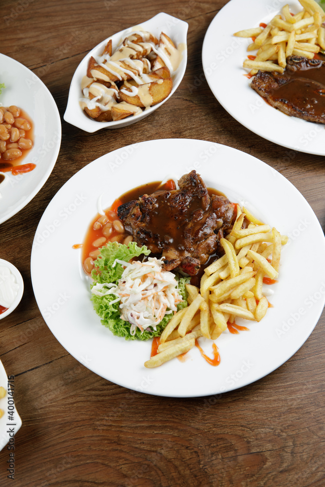 a plate of chicken grill set come with french fries and coleslaw a plate of chicken grill set come with french fries and coleslaw