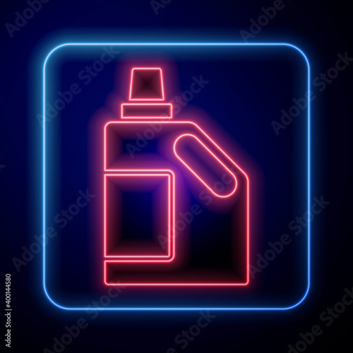 Glowing neon Plastic bottle for laundry detergent, bleach, dishwashing liquid or another cleaning agent icon isolated on blue background. Vector.