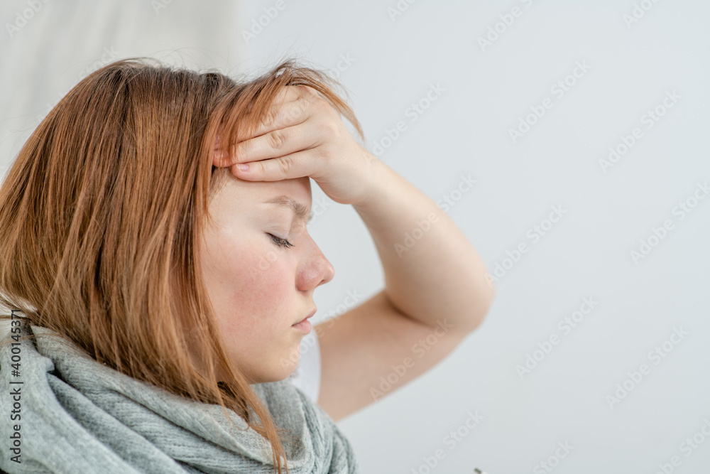 Upset depressed young woman feeling strong headache migraine, sad tired teenager exhausted girl Upset depressed young woman feeling strong headache migraine, sad tired teenager exhausted girl