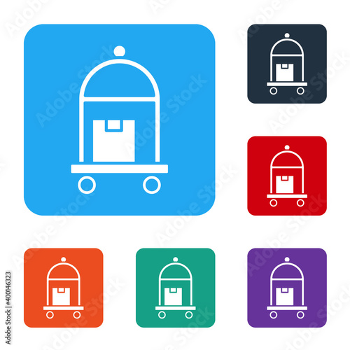 White Hotel luggage cart with suitcase icon isolated on white background. Traveling baggage sign. Travel luggage icon. Set icons in color square buttons. Vector.