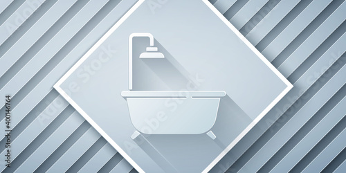 Paper cut Bathtub with shower icon isolated on grey background. Paper art style. Vector.