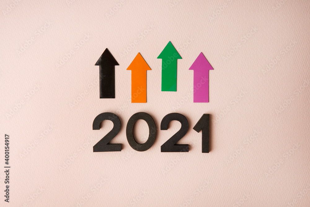 New Year 2021 with arrows on pink background New Year 2021 with arrows on pink background