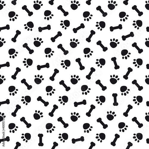 Seamless pattern with black dog paws and bones