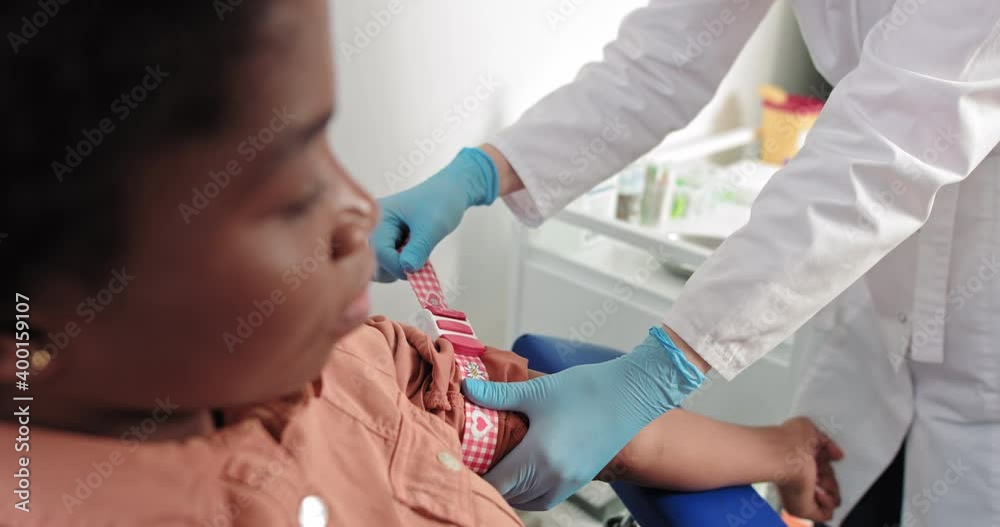 Healthcare concept. Laboratory in clinic. Female lab assistant taking venous blood for test. HIV
