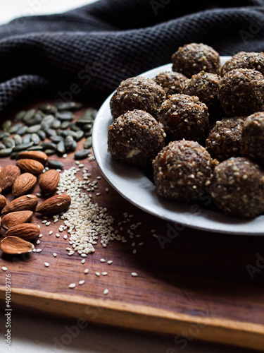 Seed and cardamom date balls in a rustic natural light setting