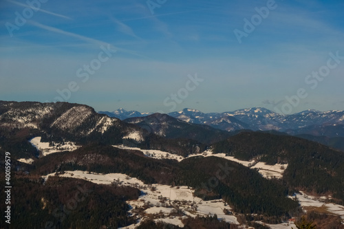 blue sky and mountains with snow while hiking in spring © thomaseder
