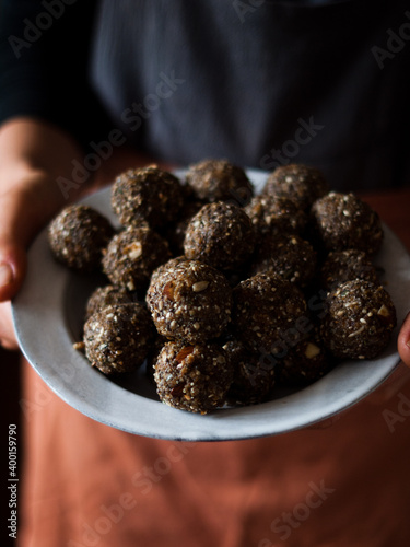 Seed and cardamom date balls in a rustic natural light setting