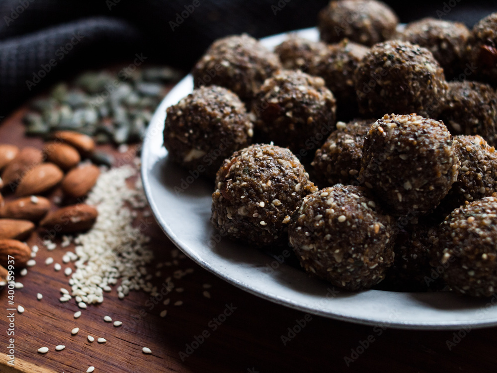 Seed and cardamom date balls in a rustic natural light setting