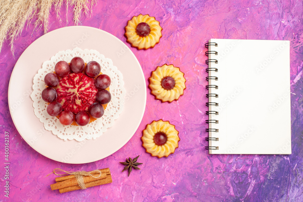 top view yummy little cookies with grapes on pink background biscuit sweet dessert cakes top view yummy little cookies with grapes on pink background biscuit sweet dessert cakes