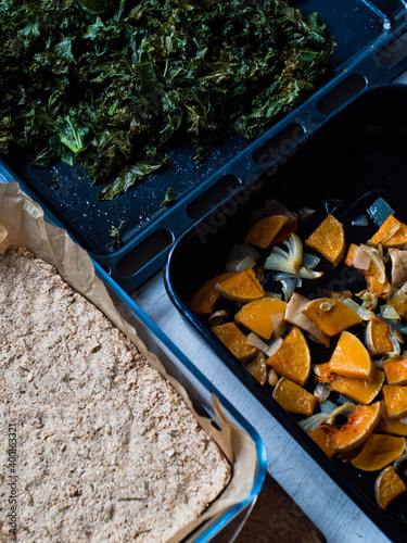 Preparation of delicious home made farm style rustic spinach pie. photo