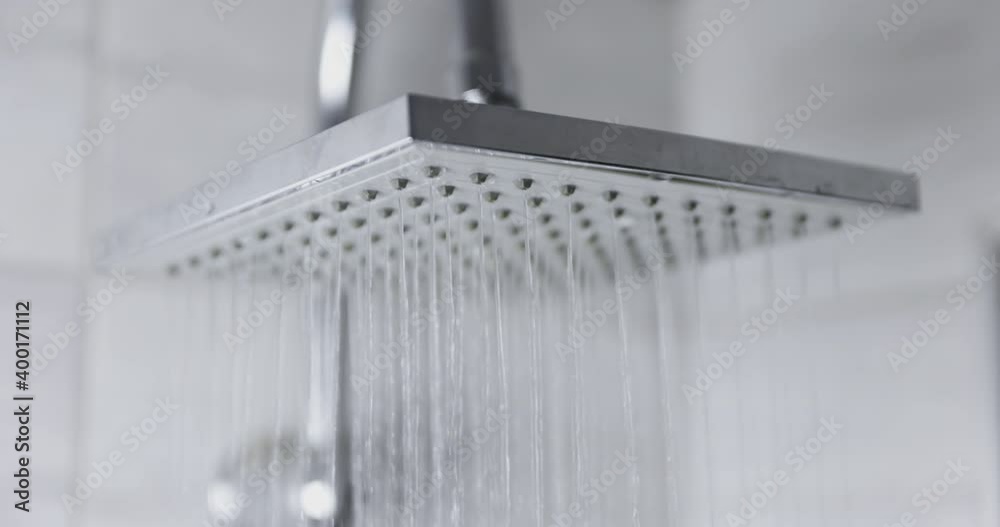 Water flowing from shower head 120 fps slow motion closeup footage