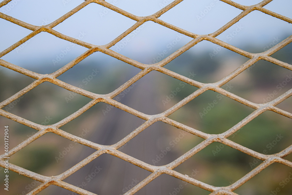Fototapeta premium Close up of old iron wire fence,vintage nate on the blur background