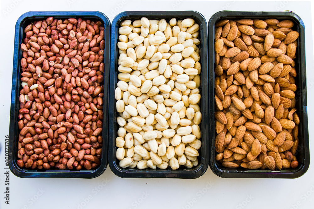 Almonds, peanut and hazelnuts in the bowl, beer and healthy snack Almonds, peanut and hazelnuts in the bowl, beer and healthy snack