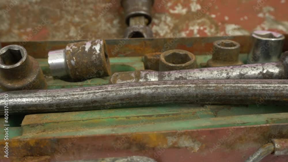 Socket sleeve heads, tools for loosening and tightening nuts. Old wrenches covered with rust. Dolly shot on white isolated. Socket sleeve heads, tools for loosening and tightening nuts. Old wrenches covered with rust. Dolly shot on white isolated.