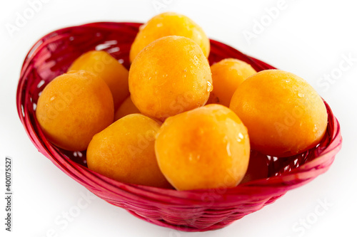 organic apricots in a pink basket