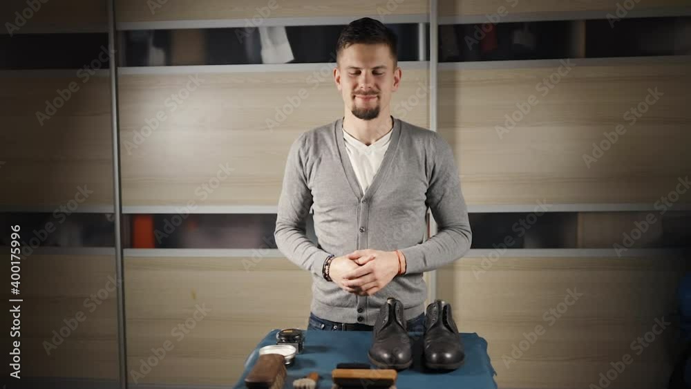 Male blogger filming tutorial about shoe care